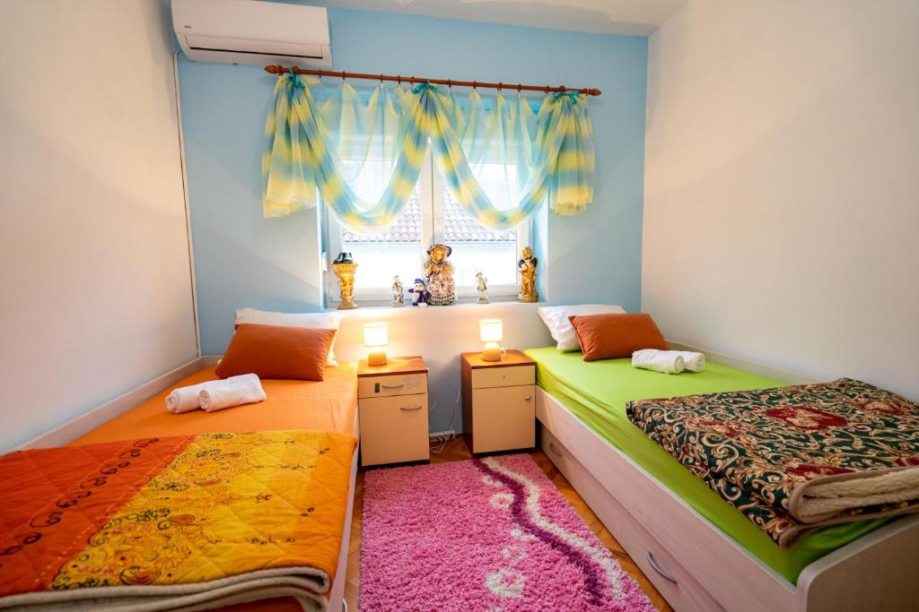 Postel nebo postele na pokoji v ubytování Apartman JOZIC