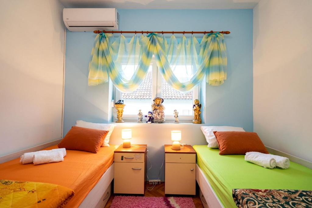 Postel nebo postele na pokoji v ubytování Apartman JOZIC