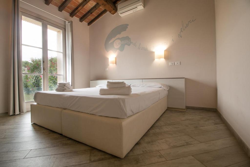 Postel nebo postele na pokoji v ubytování Fattoria Palazzeta - Pet & Family Friendly