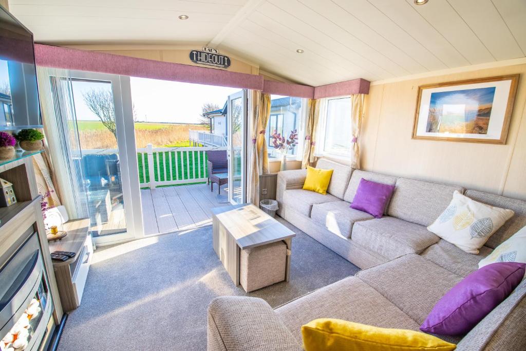 Гостиная зона в Sea 'n' Stars Platinum Plus Holiday home with Views, Free Wifi and Netflix