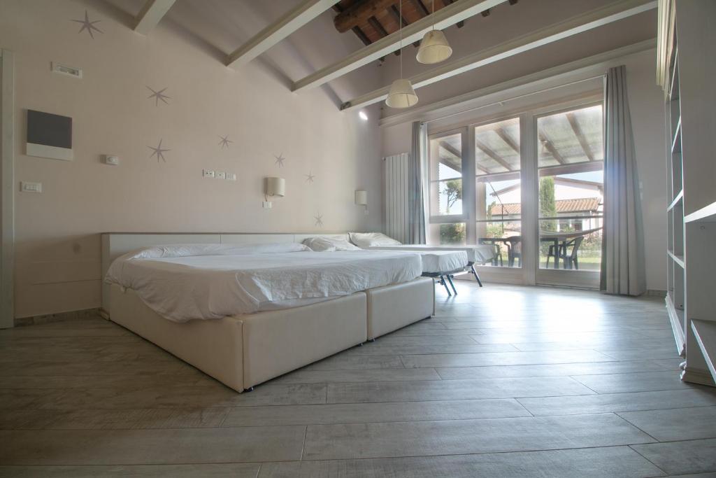 Postel nebo postele na pokoji v ubytování Fattoria Palazzeta - Pet & Family Friendly