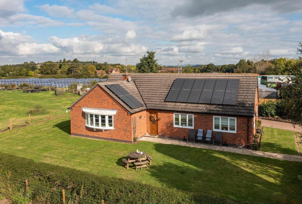 an aerial view of a house with solar panels on it at Overbrook in Droitwich
