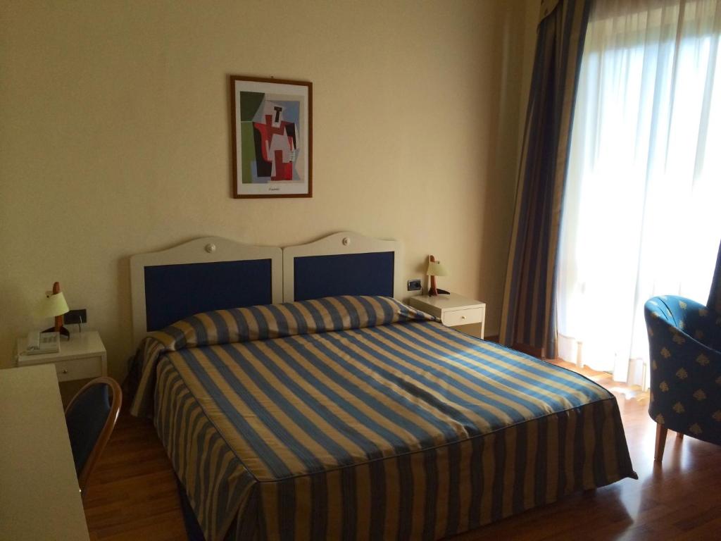 Postel nebo postele na pokoji v ubytování Hotel Brennero e Varsavia