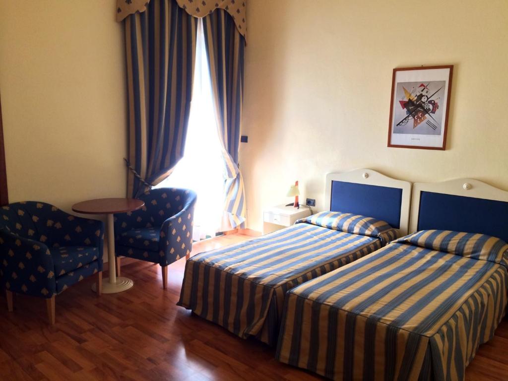 Postel nebo postele na pokoji v ubytování Hotel Brennero e Varsavia