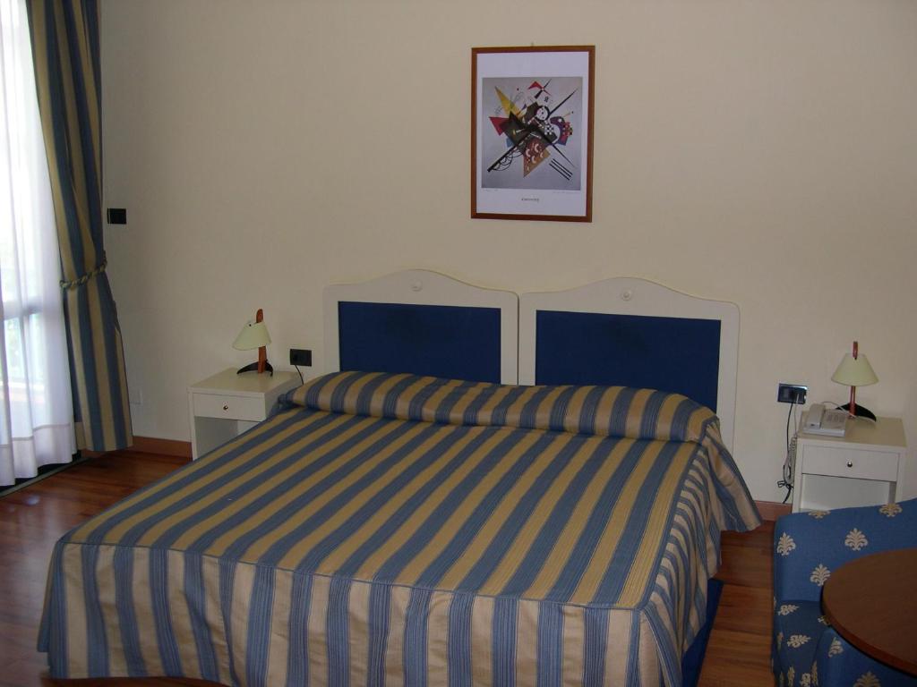 Postel nebo postele na pokoji v ubytování Hotel Brennero e Varsavia