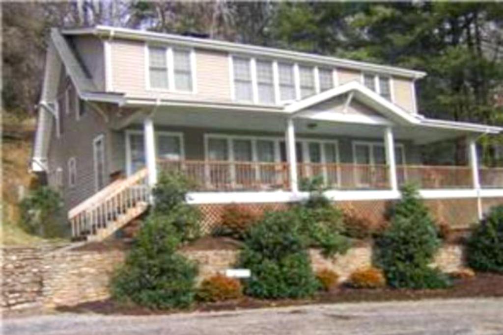 a large house with trees in front of it at Junaluska Lodge in Lake Junaluska