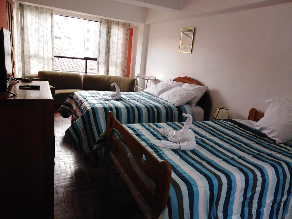 Postel nebo postele na pokoji v ubytování Kaboka Cusco Hospedaje Familiar