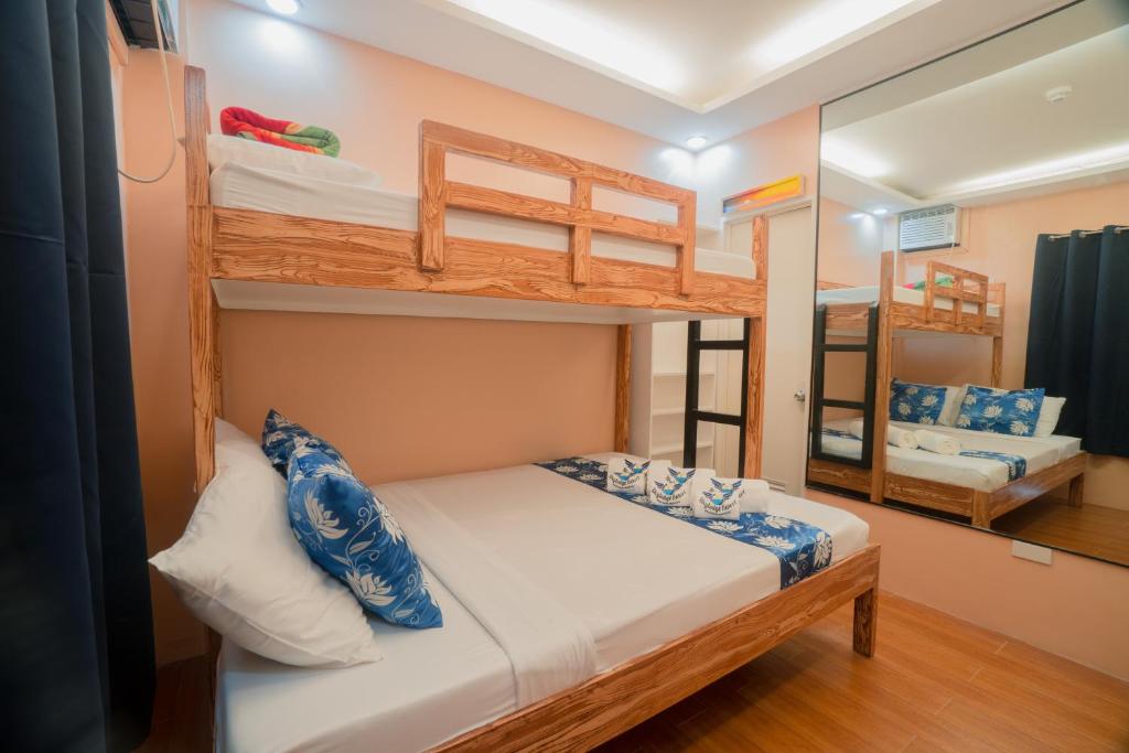 Postel nebo postele na pokoji v ubytování Skylodge Resort
