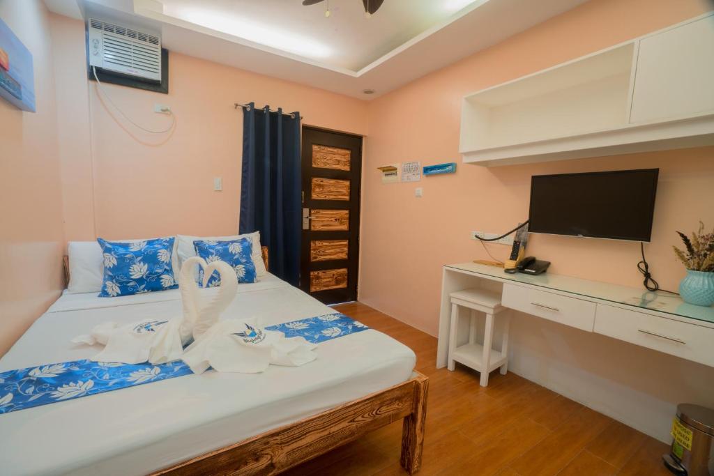 Postel nebo postele na pokoji v ubytování Skylodge Resort