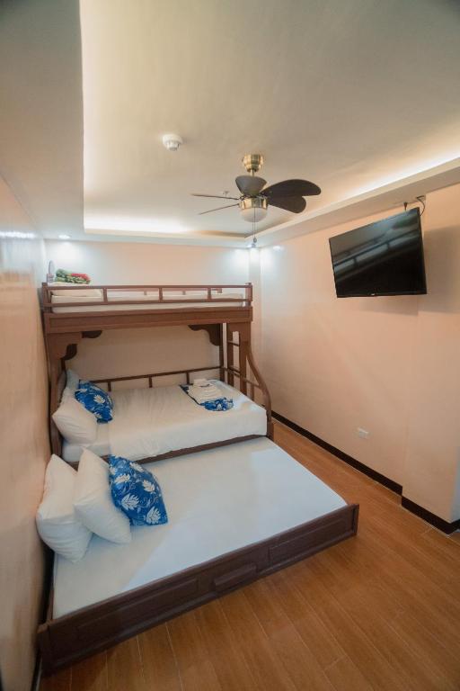 Postel nebo postele na pokoji v ubytování Skylodge Resort