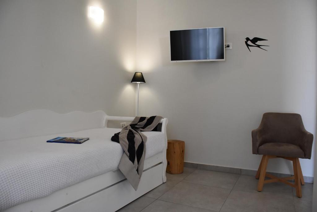 TV a/nebo společenská místnost v ubytování De_naxia Suites