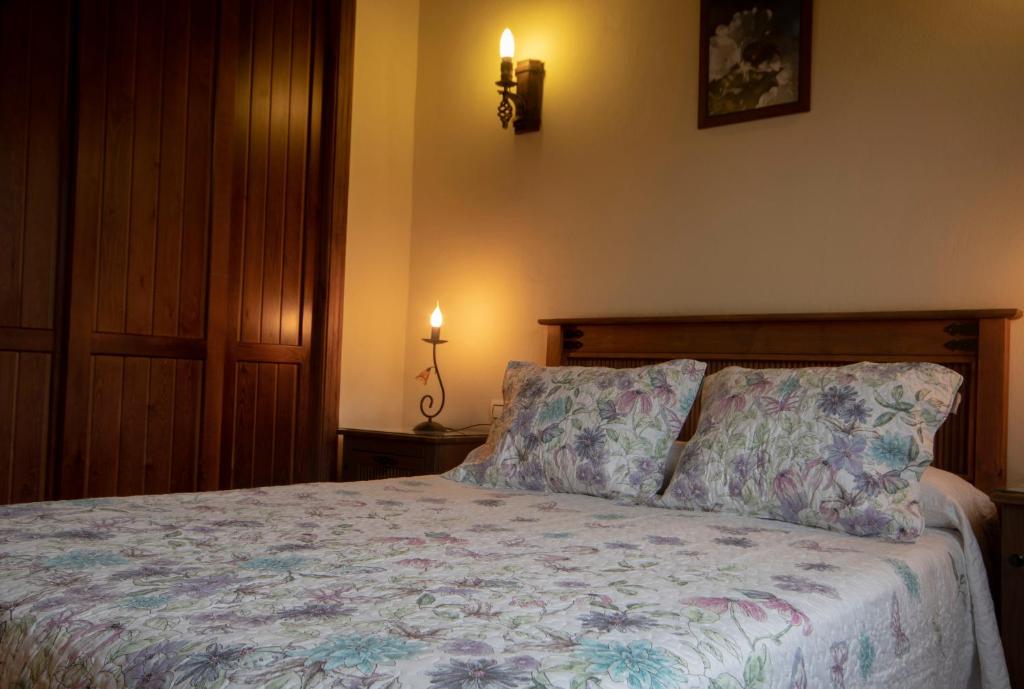 Cama o camas de una habitación en Complejo Rural Las Palomas