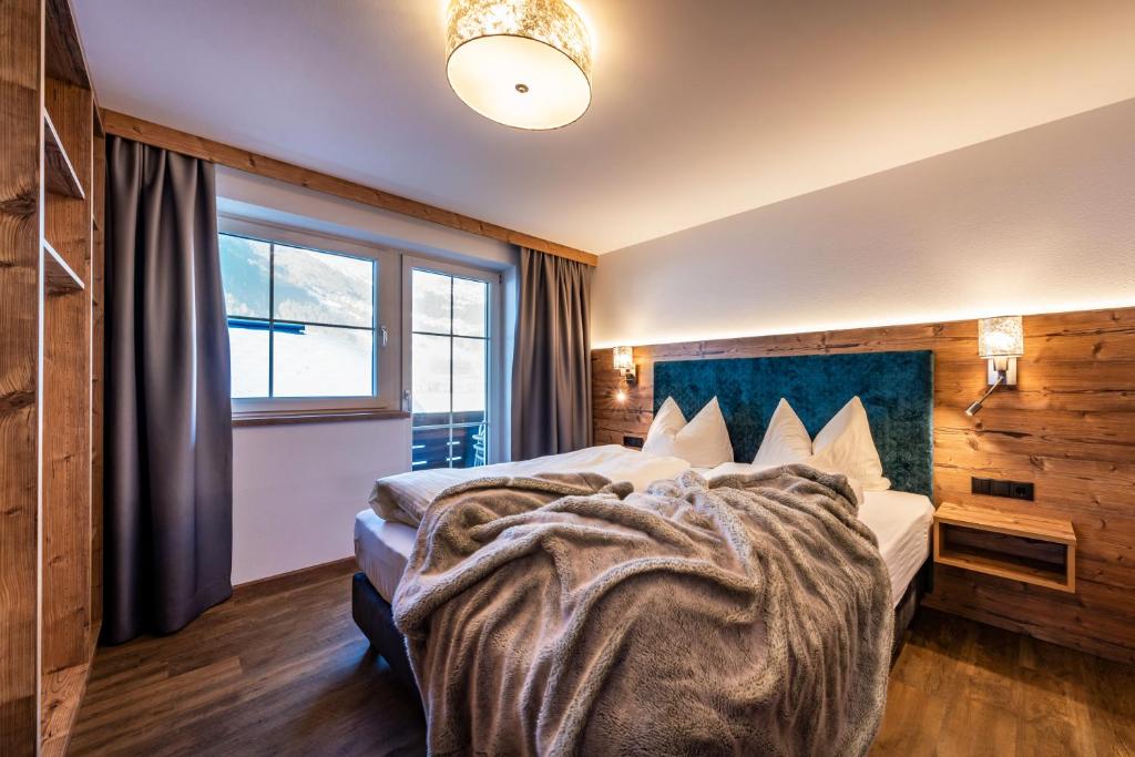 Postel nebo postele na pokoji v ubytování Gästehaus Wiesengrund & Apart Sporer