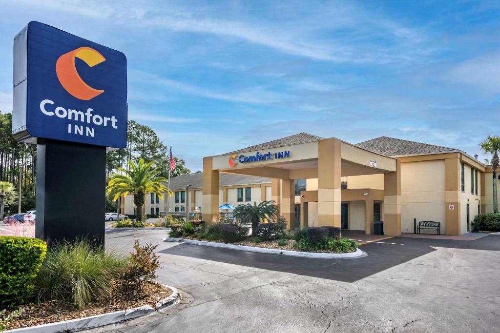 a sign in front of a hotel with a comfort inn at Comfort Inn Yulee - Fernandina Beach in Yulee