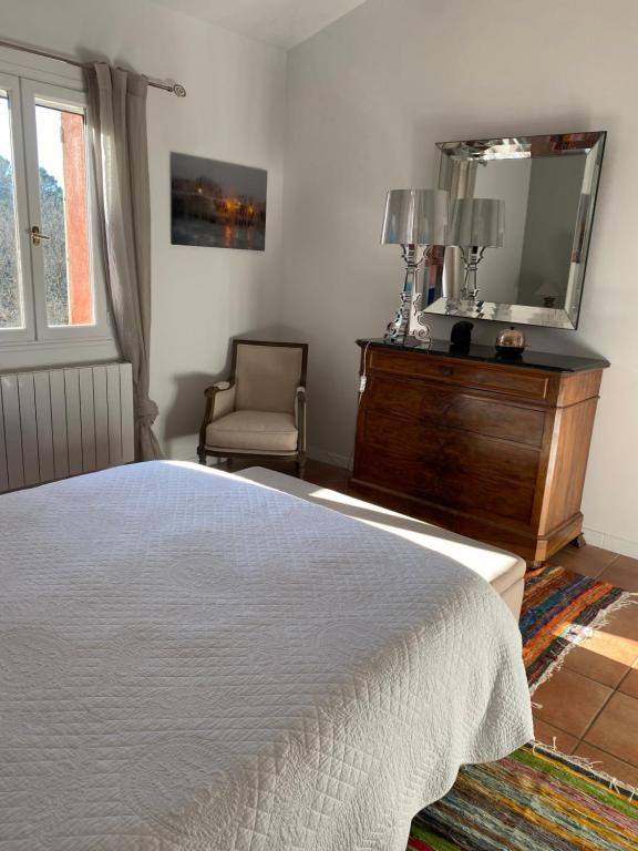 Postel nebo postele na pokoji v ubytování Villa des Roses