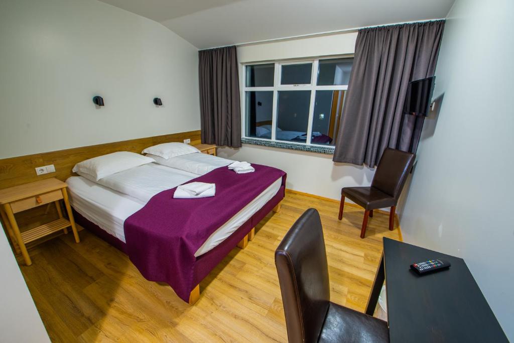 Postel nebo postele na pokoji v ubytování The Vík Inn by Ourhotels