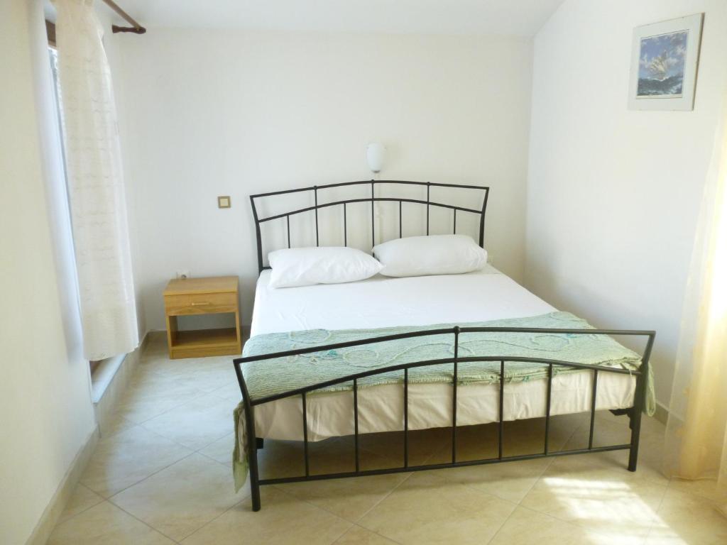 Łóżko lub łóżka w pokoju w obiekcie Apartments Spada