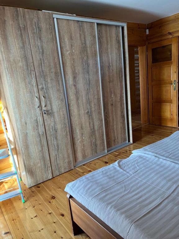 A bed or beds in a room at Zrubová Chata Sylvester