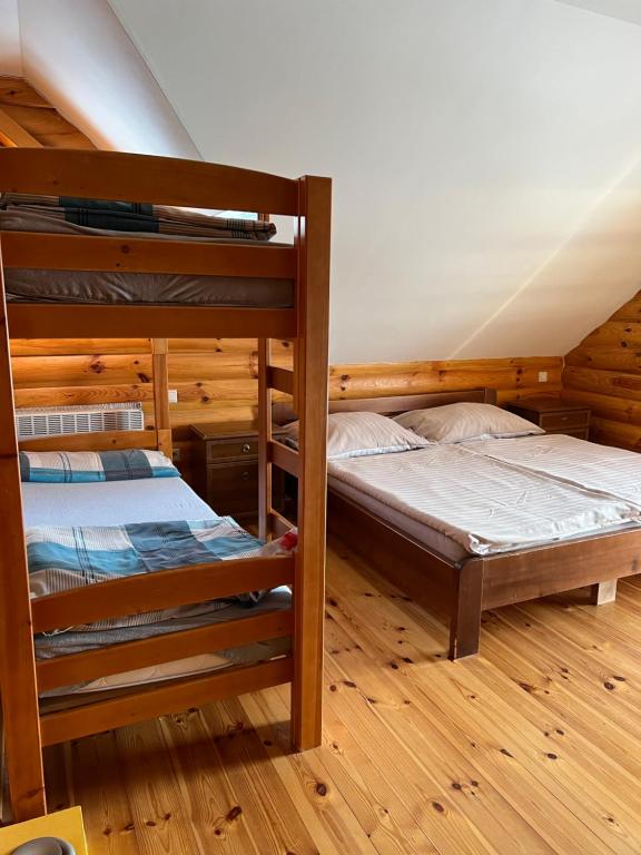 A bed or beds in a room at Zrubová Chata Sylvester