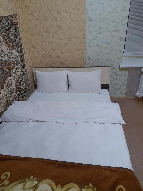 Postel nebo postele na pokoji v ubytování ВВ-ХОСТЕЛ