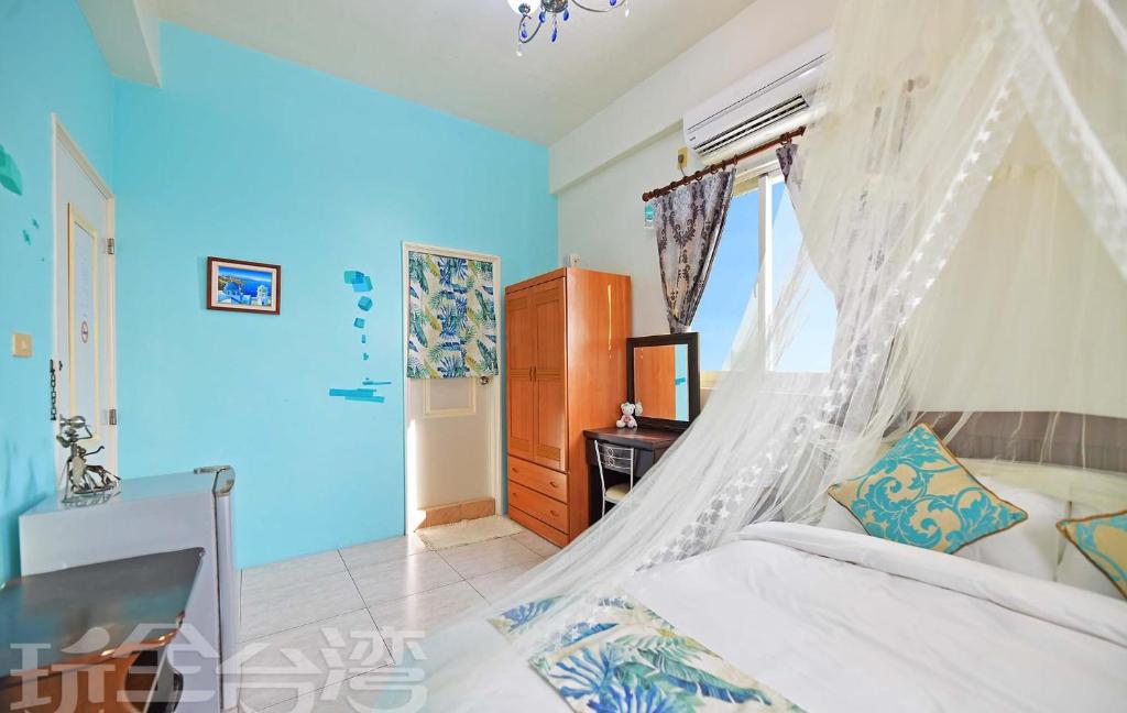 Postel nebo postele na pokoji v ubytování 沿海地帶 海景民宿 coastland B&B