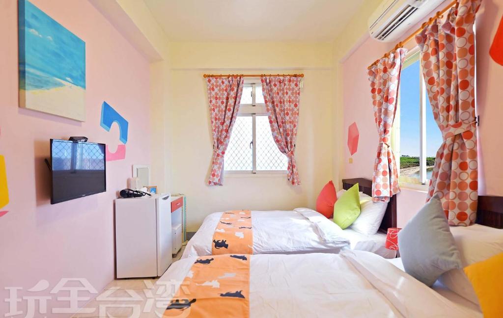 Postel nebo postele na pokoji v ubytování 沿海地帶 海景民宿 coastland B&B