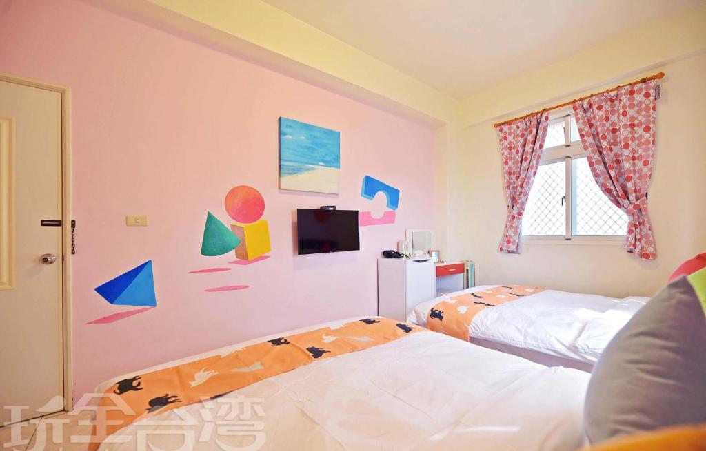Postel nebo postele na pokoji v ubytování 沿海地帶 海景民宿 coastland B&B