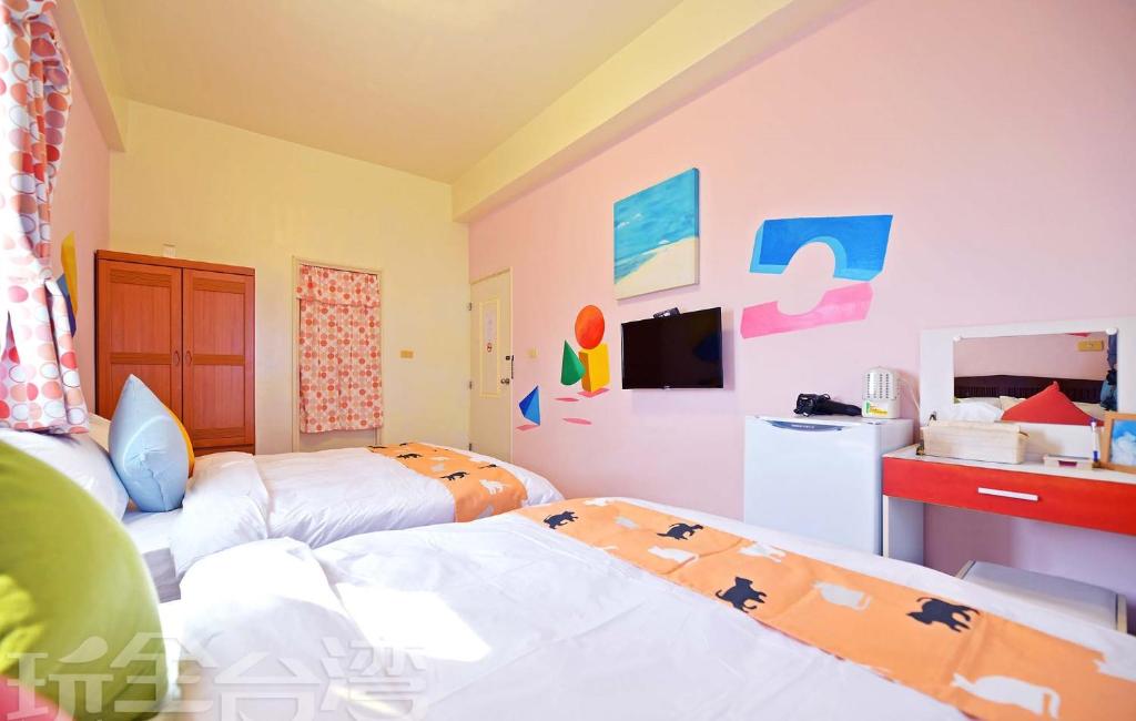 Postel nebo postele na pokoji v ubytování 沿海地帶 海景民宿 coastland B&B