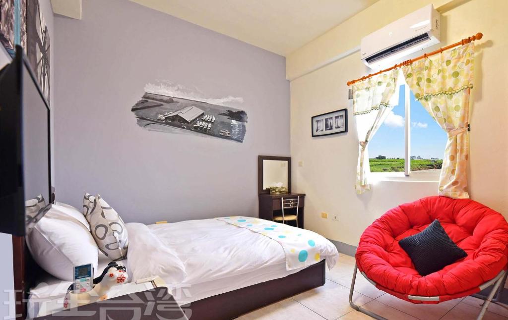 Postel nebo postele na pokoji v ubytování 沿海地帶 海景民宿 coastland B&B