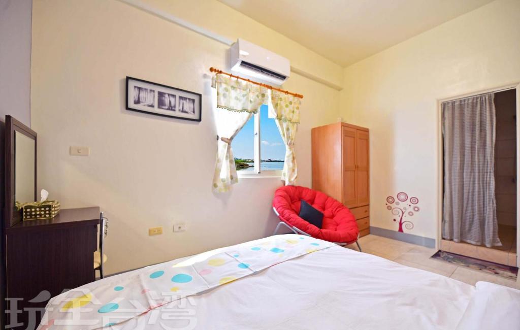 Postel nebo postele na pokoji v ubytování 沿海地帶 海景民宿 coastland B&B