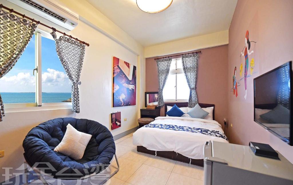 Postel nebo postele na pokoji v ubytování 沿海地帶 海景民宿 coastland B&B