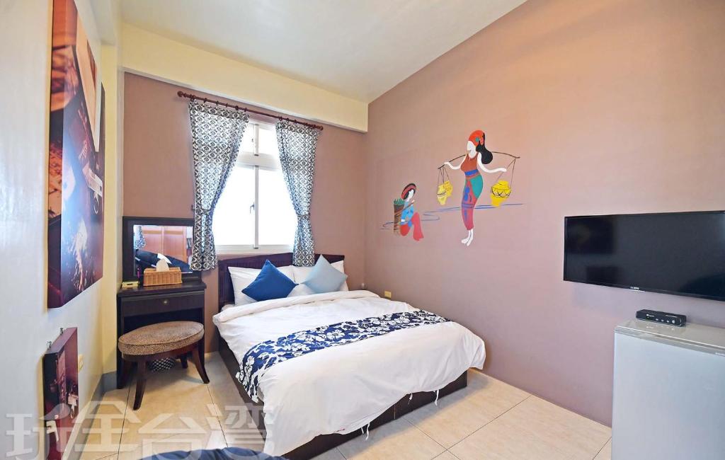 Postel nebo postele na pokoji v ubytování 沿海地帶 海景民宿 coastland B&B