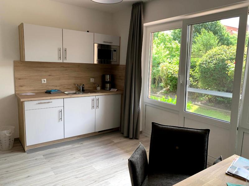 Kuchyň nebo kuchyňský kout v ubytování Hotel Schmidt's Hoern
