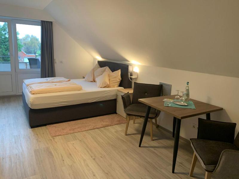 Postel nebo postele na pokoji v ubytování Hotel Schmidt's Hoern