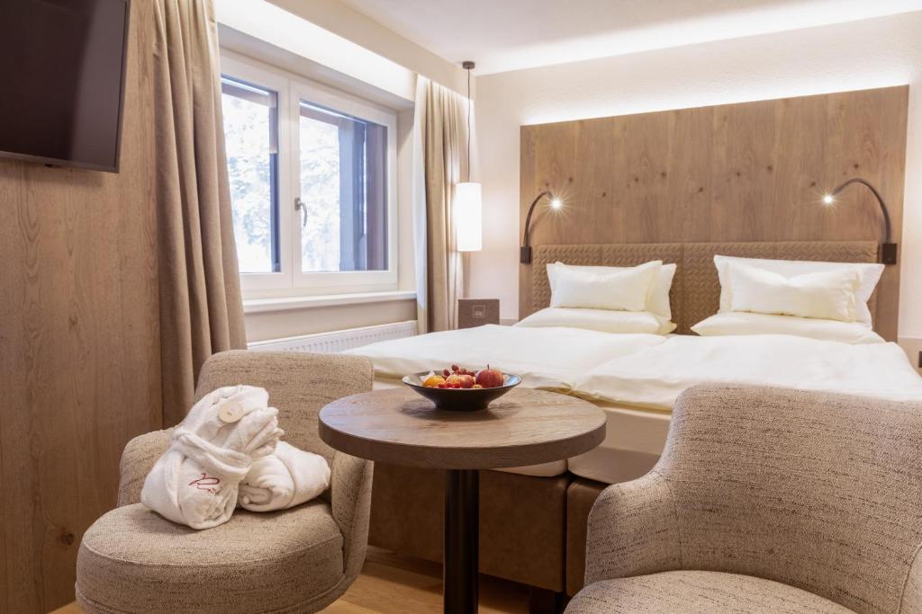 Postel nebo postele na pokoji v ubytování Hotel Rita