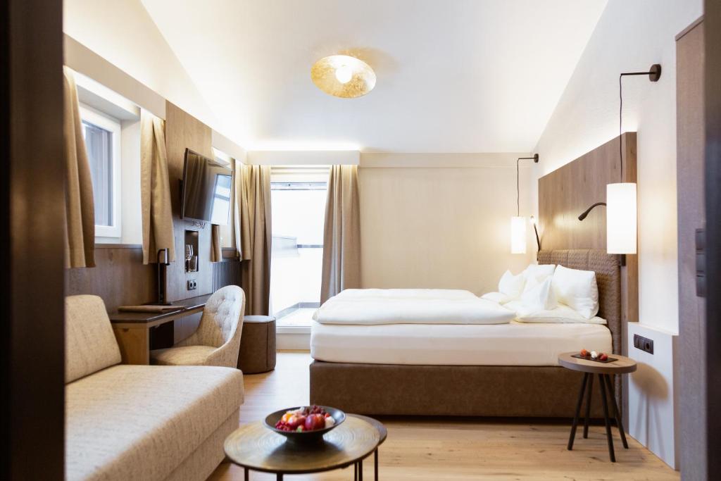 Postel nebo postele na pokoji v ubytování Hotel Rita