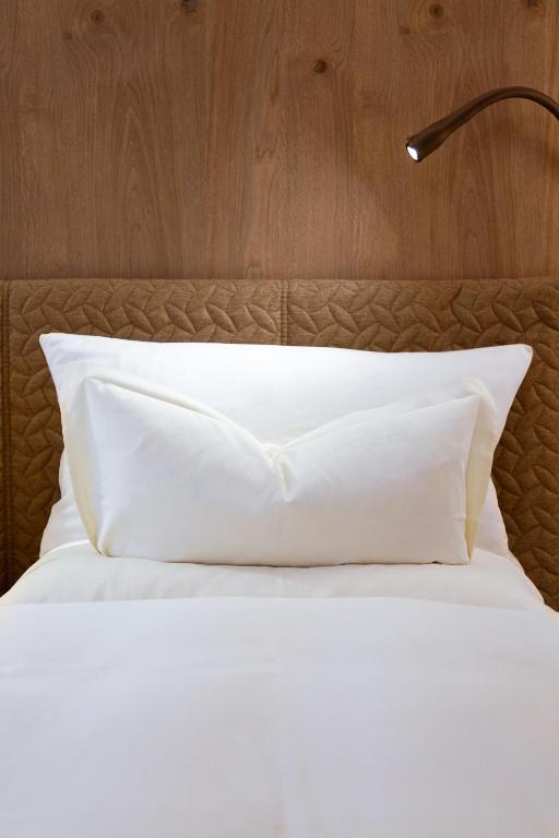 Postel nebo postele na pokoji v ubytování Hotel Rita