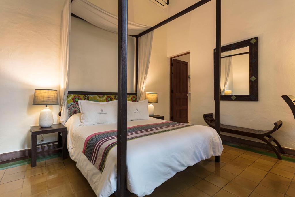 Postel nebo postele na pokoji v ubytování Hotel Villa Colonial