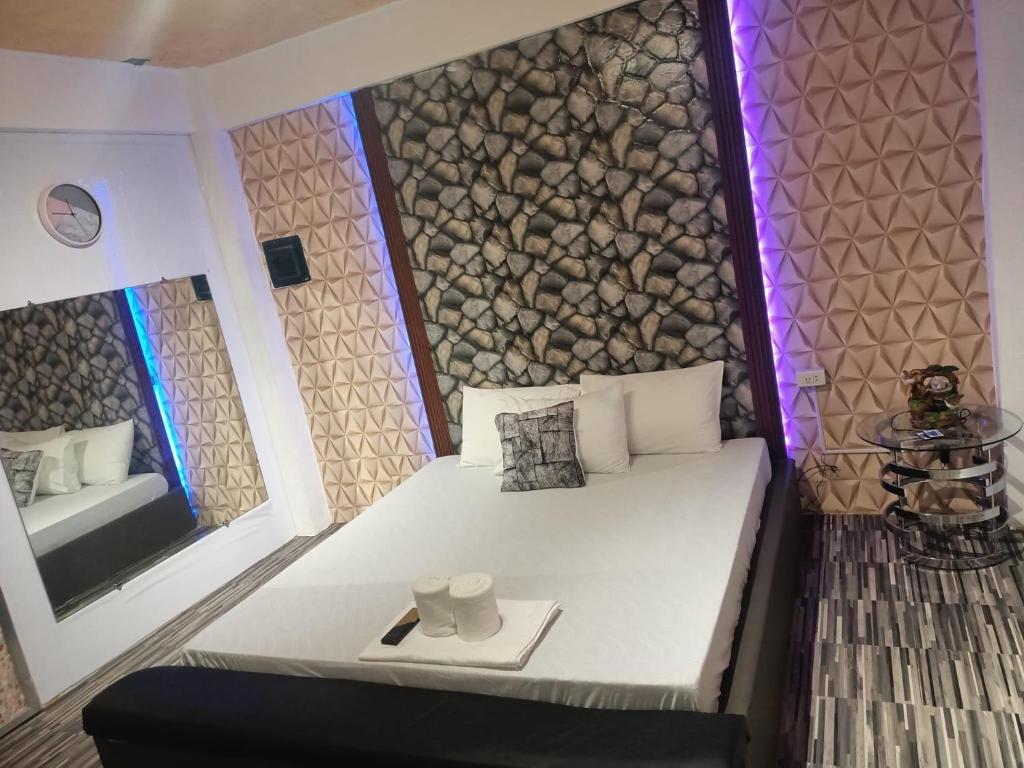 DJCI Apartelle With own kitchen & Bath 106-212 tesisinde bir odada yatak veya yataklar