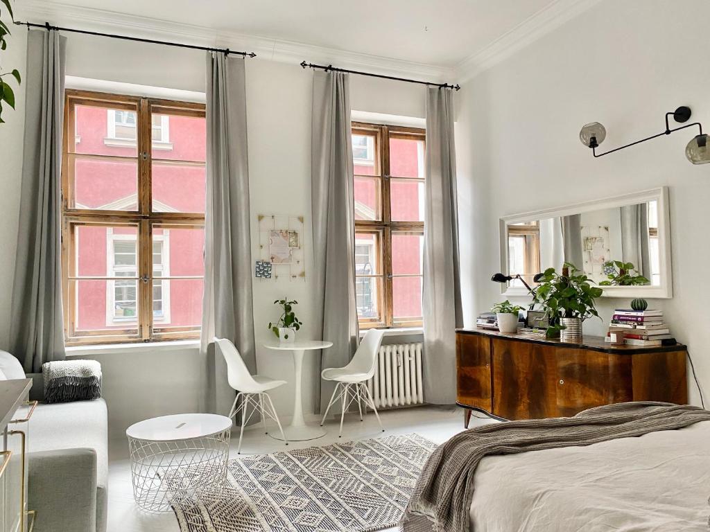 Posteľ alebo postele v izbe v ubytovaní Townhall Apartments