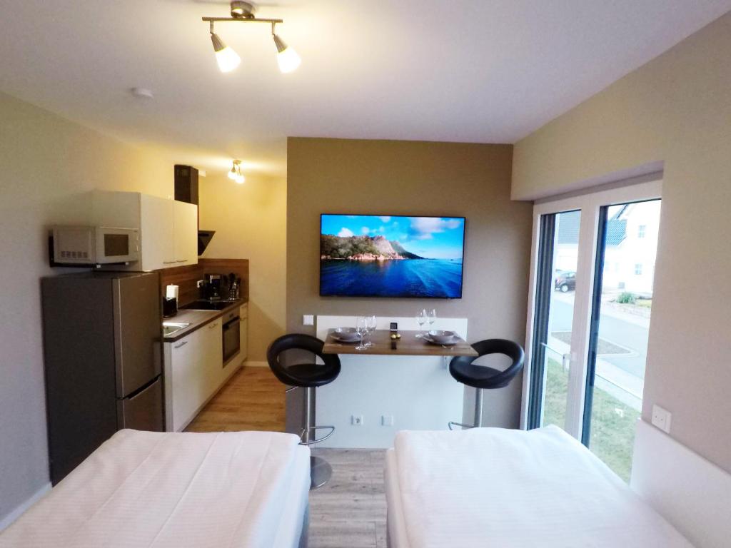 Kuchyň nebo kuchyňský kout v ubytování -Neubau- 24 qm Studio-Apartment