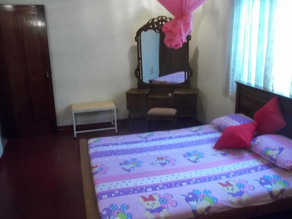 Postel nebo postele na pokoji v ubytování Anura Home Stay