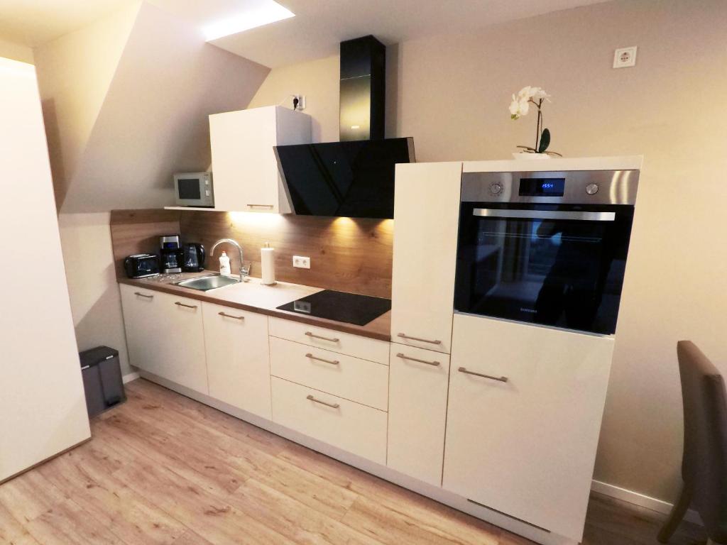 Kuchyň nebo kuchyňský kout v ubytování -Neubau- 42 qm Balkon-Apartment