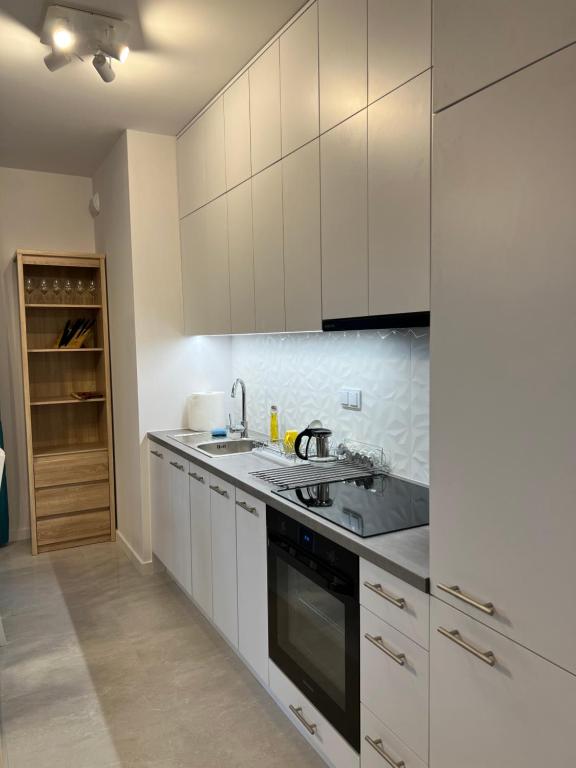 Kuchyňa alebo kuchynka v ubytovaní W Apartament , nowoczesny ,4 osobowy,