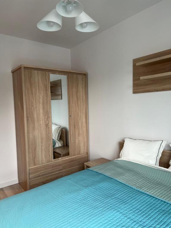 Posteľ alebo postele v izbe v ubytovaní W Apartament , nowoczesny ,4 osobowy,