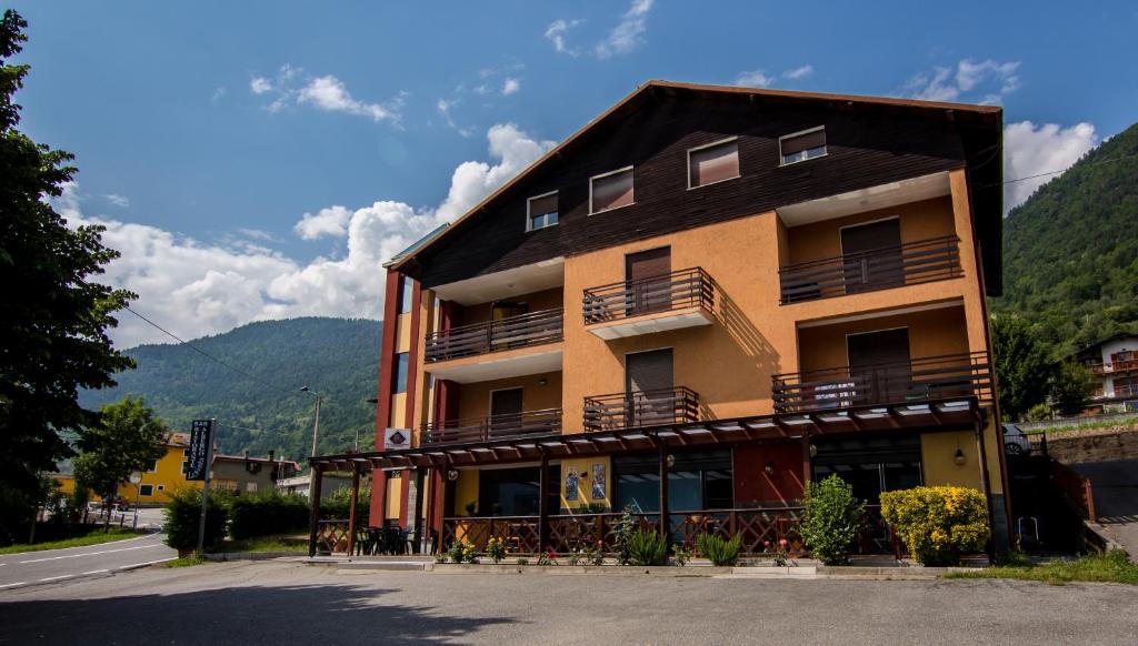 a building with balconies on the side of it at La Svolta in Chiuro