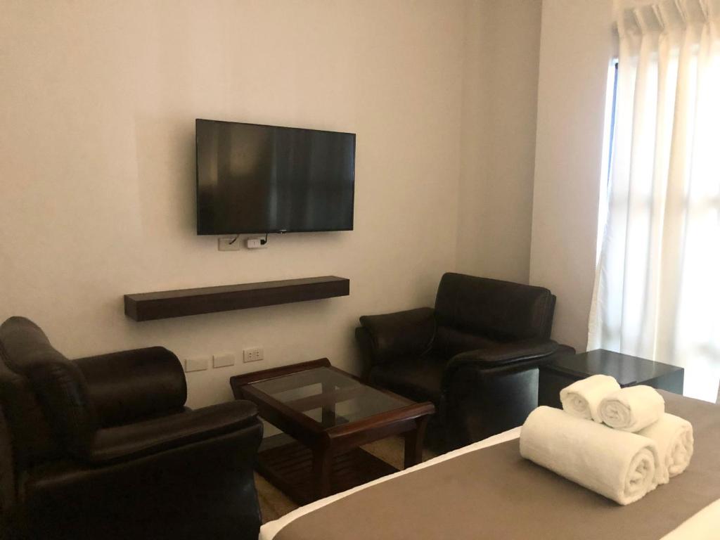 TV a/nebo společenská místnost v ubytování Seacliff Suites Hotel and Resort