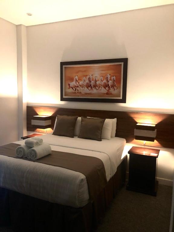 Postel nebo postele na pokoji v ubytování Seacliff Suites Hotel and Resort