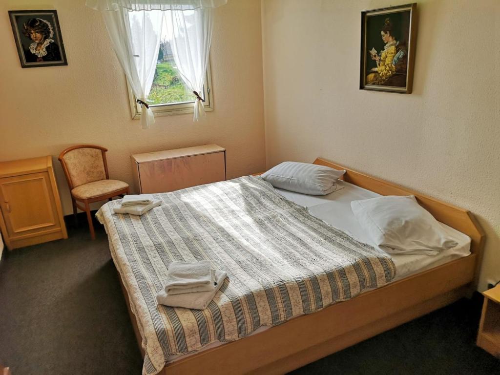 Postel nebo postele na pokoji v ubytování Hotel PAM