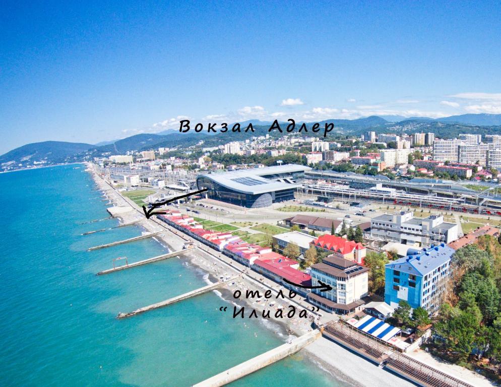 an aerial view of a city next to the water at Iliada Hotel in Adler